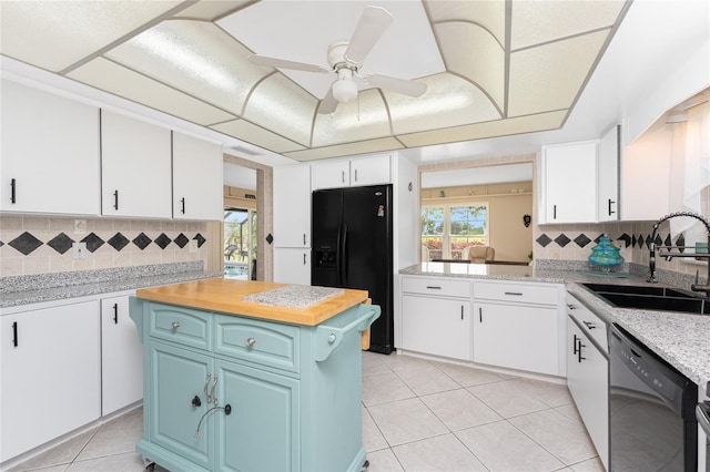 146 Rotonda Cir, Rotonda West, FL 33947 - kitchen featuring black appliances, a sink, plenty of natural light, and light tile patterned flooring