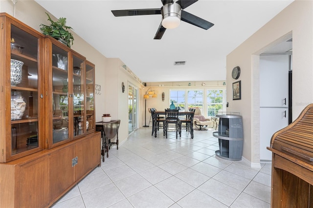 146 Rotonda Cir, Rotonda West, FL 33947 - dining area featuring light tile patterned flooring, a ceiling fan, and baseboards