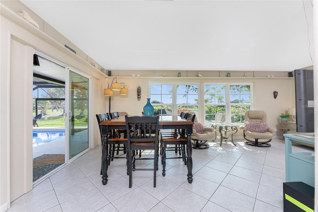 146 Rotonda Cir, Rotonda West, FL 33947 - dining room featuring light tile patterned floors and plenty of natural light