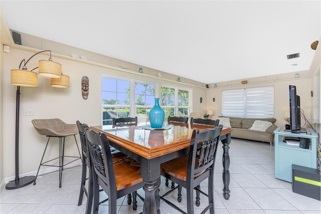 146 Rotonda Cir, Rotonda West, FL 33947 - dining area with light tile patterned floors and baseboards