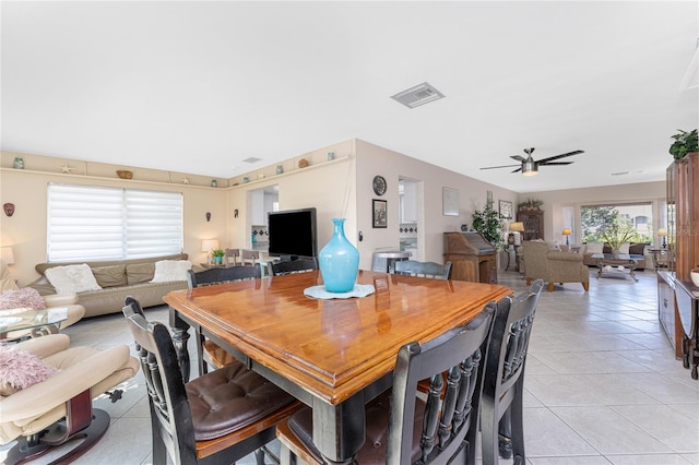 146 Rotonda Cir, Rotonda West, FL 33947 - dining room with light tile patterned floors and ceiling fan