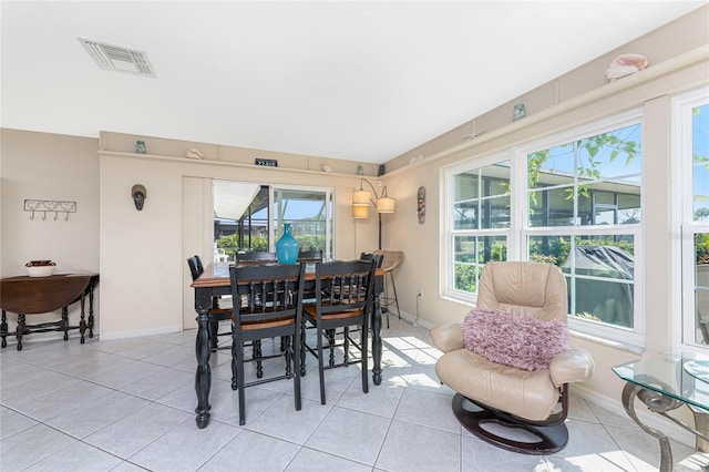 146 Rotonda Cir, Rotonda West, FL 33947 - dining area with light tile patterned floors and baseboards
