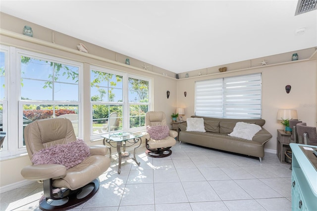 146 Rotonda Cir, Rotonda West, FL 33947 - living area featuring healthy amount of natural light, light tile patterned floors, and baseboards