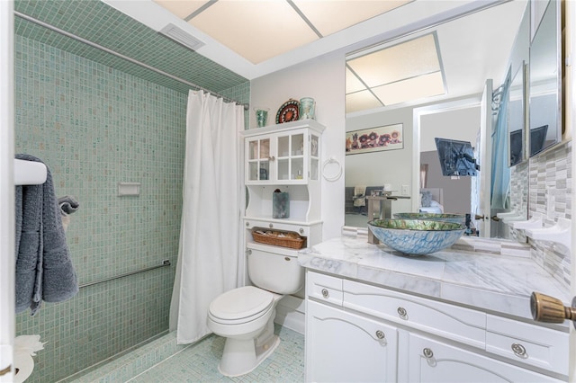 146 Rotonda Cir, Rotonda West, FL 33947 - full bathroom with toilet, a tile shower, vanity, and tile patterned floors