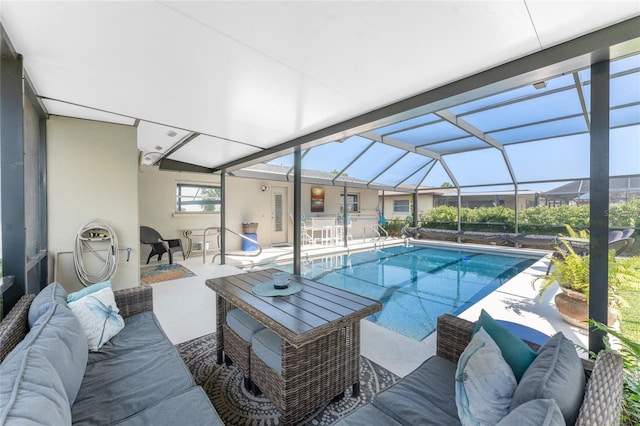 146 Rotonda Cir, Rotonda West, FL 33947 - swimming pool featuring an outdoor living space, a patio area, and glass enclosure