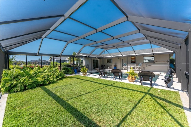146 Rotonda Cir, Rotonda West, FL 33947 - back of property featuring a patio area, a lawn, an outdoor pool, and glass enclosure