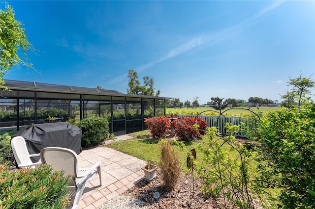 146 Rotonda Cir, Rotonda West, FL 33947 - fenced backyard with a patio area and a lanai