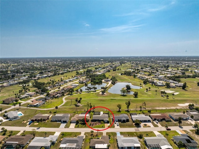 146 Rotonda Cir, Rotonda West, FL 33947 - aerial view of property's location featuring a large body of water, nearby suburban area, and a golf course