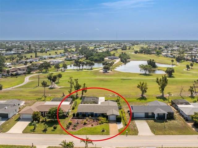 146 Rotonda Cir, Rotonda West, FL 33947 - aerial view of residential area with a nearby body of water and a golf club