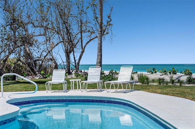 2979 Shore Ln, Boca Grande, FL 33921 - swimming pool featuring a water view and a yard
