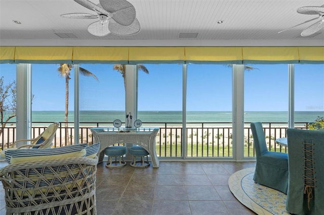 2979 Shore Ln, Boca Grande, FL 33921 - sunroom / solarium with a water view and tile patterned flooring