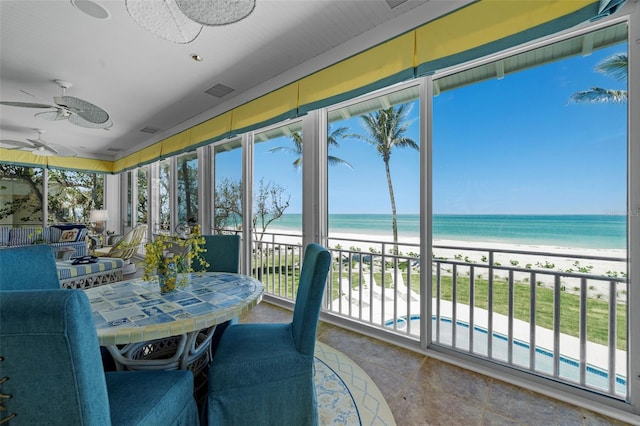 2979 Shore Ln, Boca Grande, FL 33921 - sunroom / solarium featuring view of water and beach and tile patterned flooring