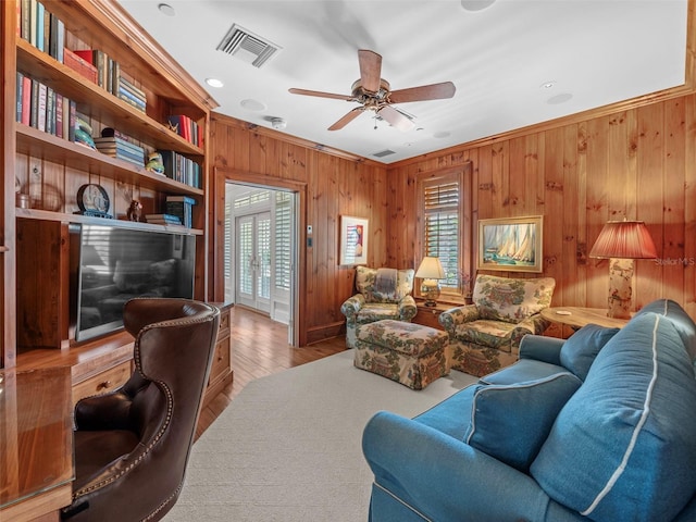 2979 Shore Ln, Boca Grande, FL 33921 - living room featuring wooden walls, ceiling fan, wood finished floors, crown molding, and recessed lighting