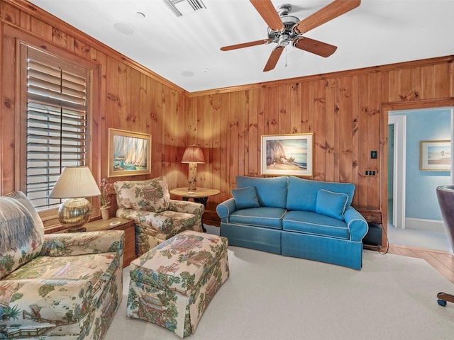 2979 Shore Ln, Boca Grande, FL 33921 - living area with wooden walls and ceiling fan
