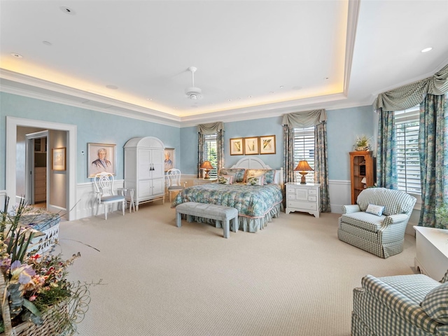 2979 Shore Ln, Boca Grande, FL 33921 - bedroom featuring carpet flooring, wainscoting, crown molding, and a tray ceiling
