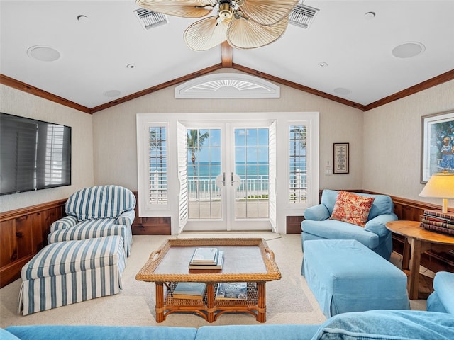 2979 Shore Ln, Boca Grande, FL 33921 - living area featuring vaulted ceiling, carpet floors, a ceiling fan, wainscoting, and french doors