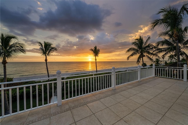 2979 Shore Ln, Boca Grande, FL 33921 - patio terrace at dusk featuring view of water and beach