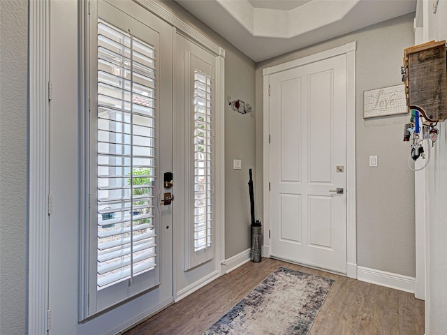 2590 Tarpon Cove Dr Unit 811, Punta Gorda, FL 33950 - foyer with wood finished floors, baseboards, and healthy amount of natural light