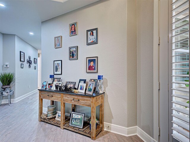 2590 Tarpon Cove Dr Unit 811, Punta Gorda, FL 33950 - corridor with wood finished floors, baseboards, recessed lighting, and a textured wall