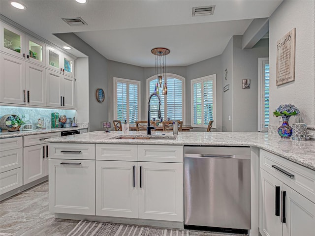 2590 Tarpon Cove Dr Unit 811, Punta Gorda, FL 33950 - kitchen featuring dishwasher, a sink, recessed lighting, light stone counters, and white cabinetry