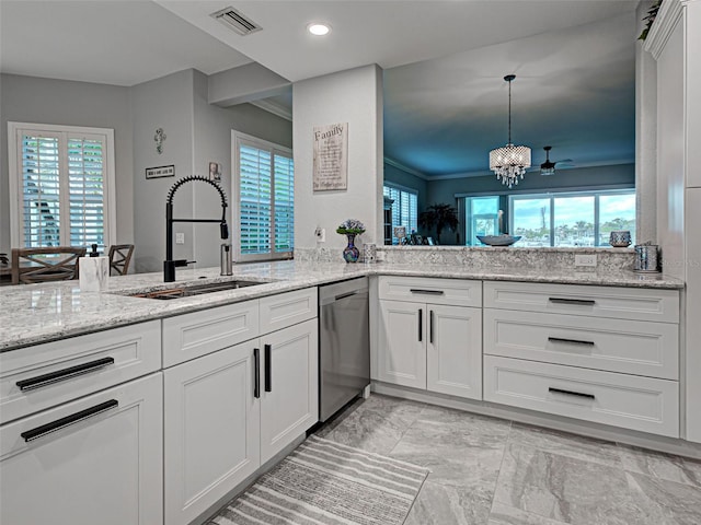 2590 Tarpon Cove Dr Unit 811, Punta Gorda, FL 33950 - kitchen featuring dishwasher, a sink, light marble finish flooring, white cabinets, and light stone counters