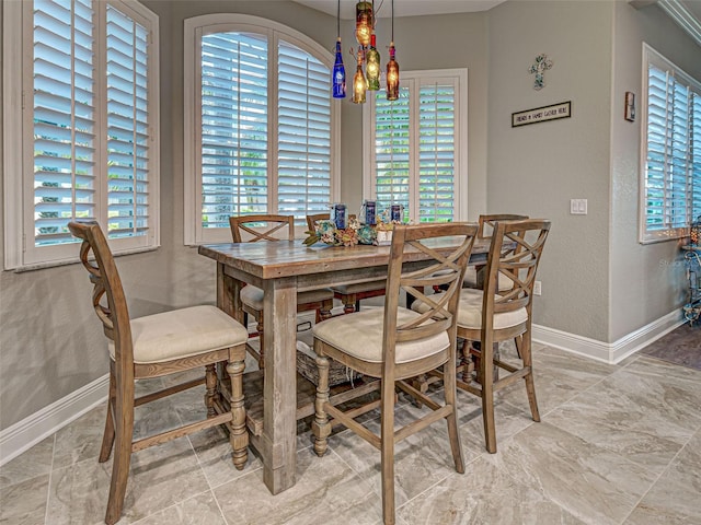 2590 Tarpon Cove Dr Unit 811, Punta Gorda, FL 33950 - dining room featuring baseboards, a textured wall, and a chandelier