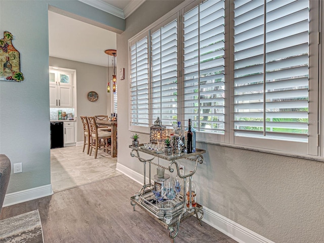 2590 Tarpon Cove Dr Unit 811, Punta Gorda, FL 33950 - corridor with ornamental molding, wood finished floors, and baseboards