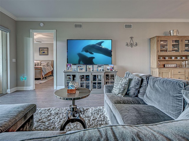 2590 Tarpon Cove Dr Unit 811, Punta Gorda, FL 33950 - living area with wood finished floors, ornamental molding, and baseboards