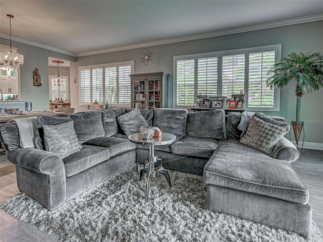 2590 Tarpon Cove Dr Unit 811, Punta Gorda, FL 33950 - living room featuring wood finished floors, crown molding, a chandelier, and baseboards