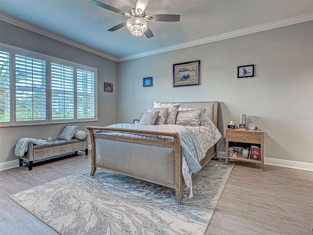 2590 Tarpon Cove Dr Unit 811, Punta Gorda, FL 33950 - bedroom with baseboards, ornamental molding, wood finished floors, and ceiling fan