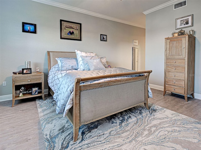 2590 Tarpon Cove Dr Unit 811, Punta Gorda, FL 33950 - bedroom featuring wood finished floors, crown molding, and baseboards