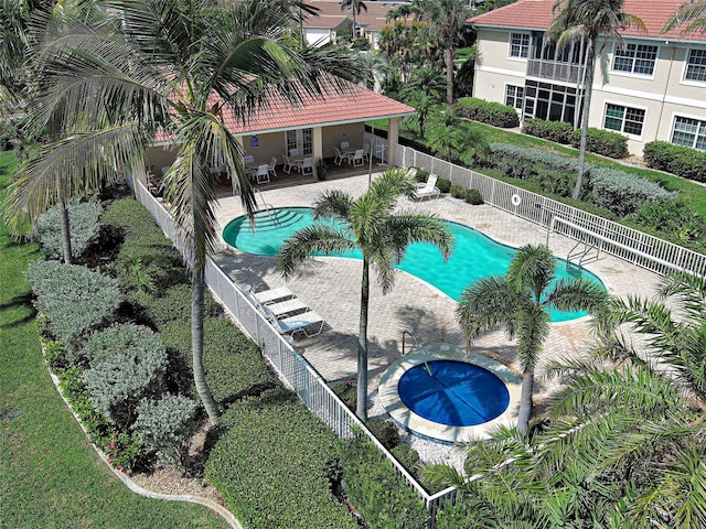 2590 Tarpon Cove Dr Unit 811, Punta Gorda, FL 33950 - community pool with a patio, a fenced backyard, and french doors
