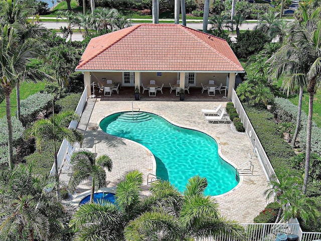 2590 Tarpon Cove Dr Unit 811, Punta Gorda, FL 33950 - view of pool featuring a fenced backyard, a patio, french doors, outdoor lounge area, and outdoor dining space