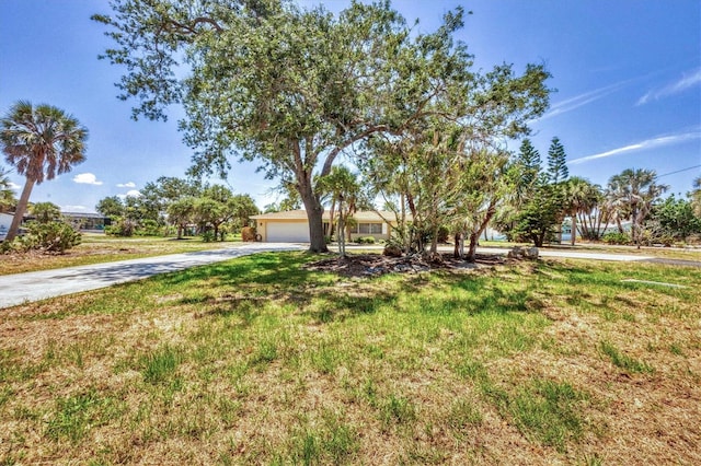 500 Green Dolphin Dr S, Placida, FL 33946 - view of front of property featuring concrete driveway and a front lawn