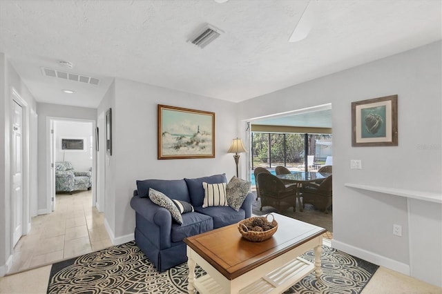 500 Green Dolphin Dr S, Placida, FL 33946 - living area with baseboards and a textured ceiling