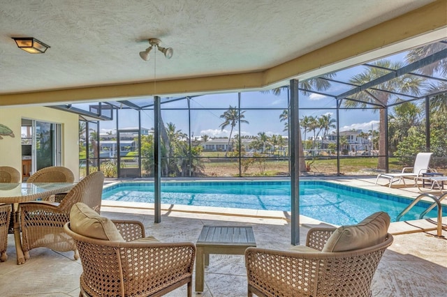 500 Green Dolphin Dr S, Placida, FL 33946 - swimming pool with glass enclosure and a patio area