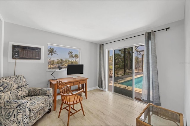 500 Green Dolphin Dr S, Placida, FL 33946 - home office with a wall mounted AC and light wood-type flooring