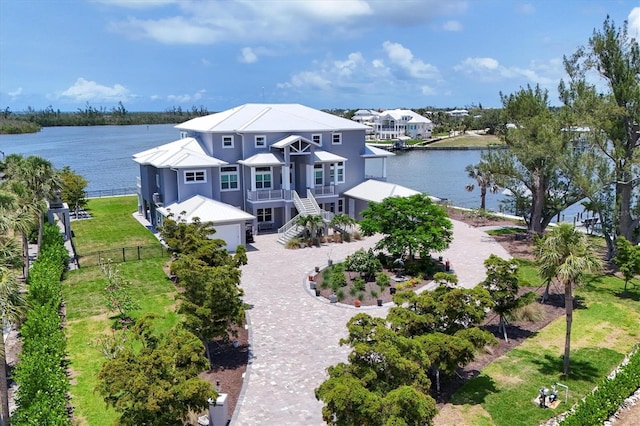 565 Green Dolphin Dr S, Placida, FL 33946 - view of front of property with a water view and driveway