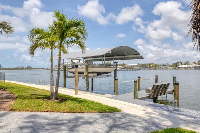 565 Green Dolphin Dr S, Placida, FL 33946 - dock area featuring boat lift and a water view