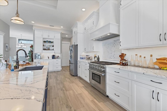 565 Green Dolphin Dr S, Placida, FL 33946 - kitchen with appliances with stainless steel finishes, custom range hood, a sink, open shelves, and white cabinets