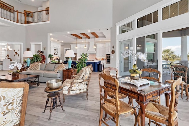 565 Green Dolphin Dr S, Placida, FL 33946 - dining room featuring a high ceiling and a chandelier