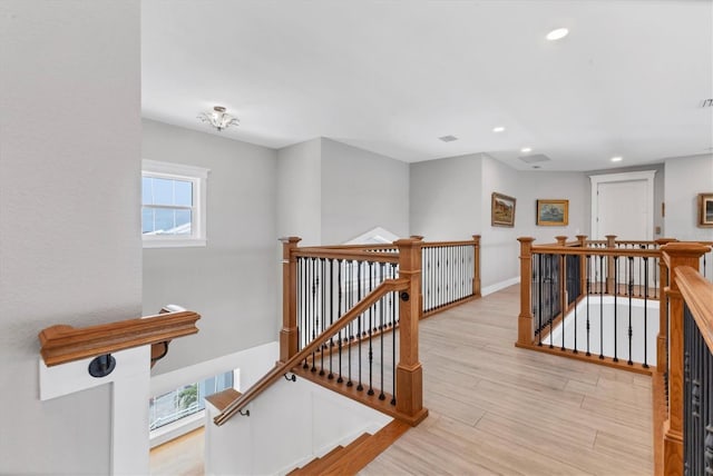 565 Green Dolphin Dr S, Placida, FL 33946 - corridor with an upstairs landing, recessed lighting, light wood finished floors, and baseboards