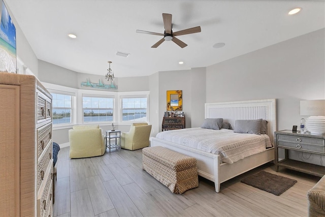 565 Green Dolphin Dr S, Placida, FL 33946 - bedroom featuring light wood-type flooring, a chandelier, recessed lighting, a ceiling fan, and baseboards