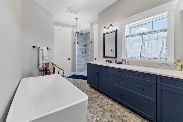 565 Green Dolphin Dr S, Placida, FL 33946 - bathroom featuring a walk in shower, a freestanding bath, and vanity