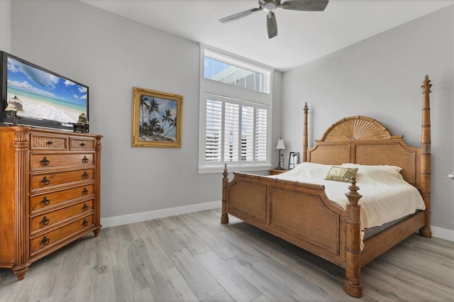 565 Green Dolphin Dr S, Placida, FL 33946 - bedroom with light wood finished floors, baseboards, and a ceiling fan