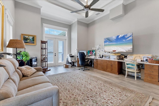 565 Green Dolphin Dr S, Placida, FL 33946 - office area featuring ornamental molding, light wood-type flooring, a towering ceiling, french doors, and a ceiling fan