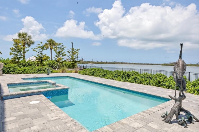 565 Green Dolphin Dr S, Placida, FL 33946 - view of swimming pool with a pool with connected hot tub, a water view, and a patio
