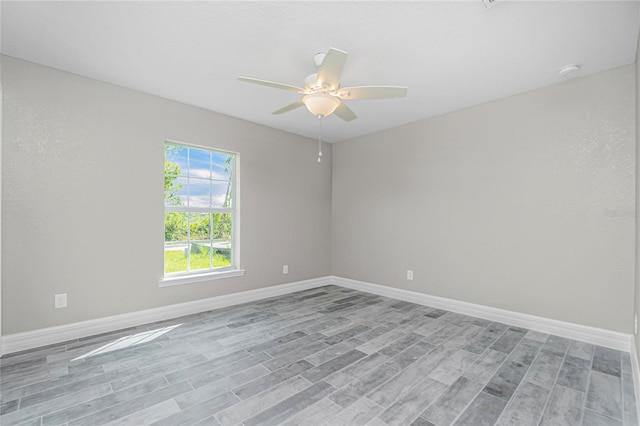 8270 Cook Ct, Port Charlotte, FL 33981 - empty room featuring light wood-style floors, ceiling fan, and baseboards