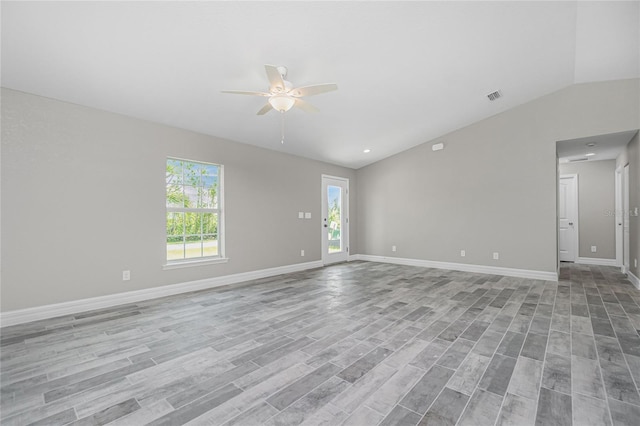8270 Cook Ct, Port Charlotte, FL 33981 - spare room with a ceiling fan, vaulted ceiling, light wood-type flooring, and baseboards