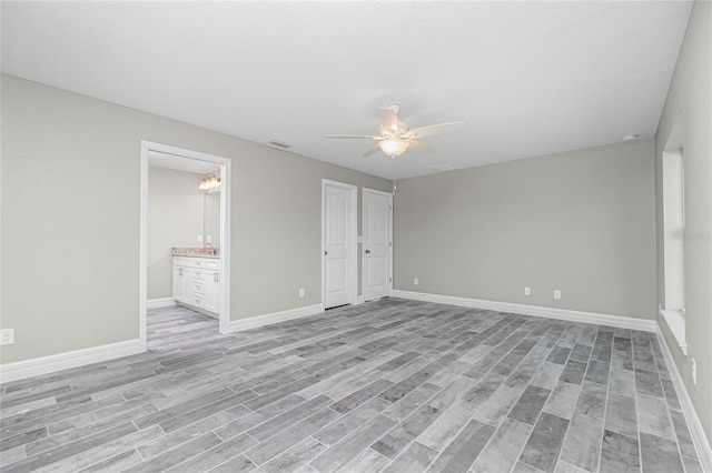 8270 Cook Ct, Port Charlotte, FL 33981 - unfurnished bedroom with light wood finished floors, baseboards, and a ceiling fan
